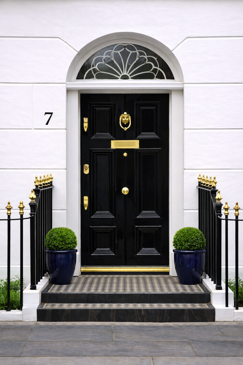 Black front door with brass fittings
